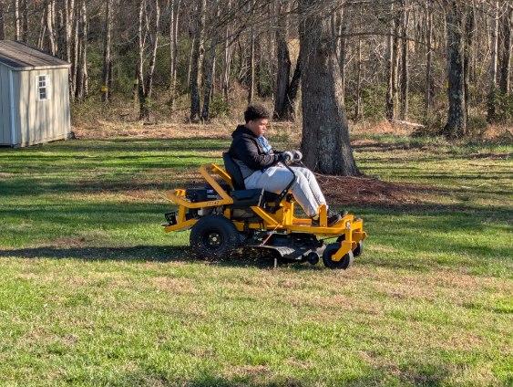 The Chore Champion crew mowing a property with professional equipment